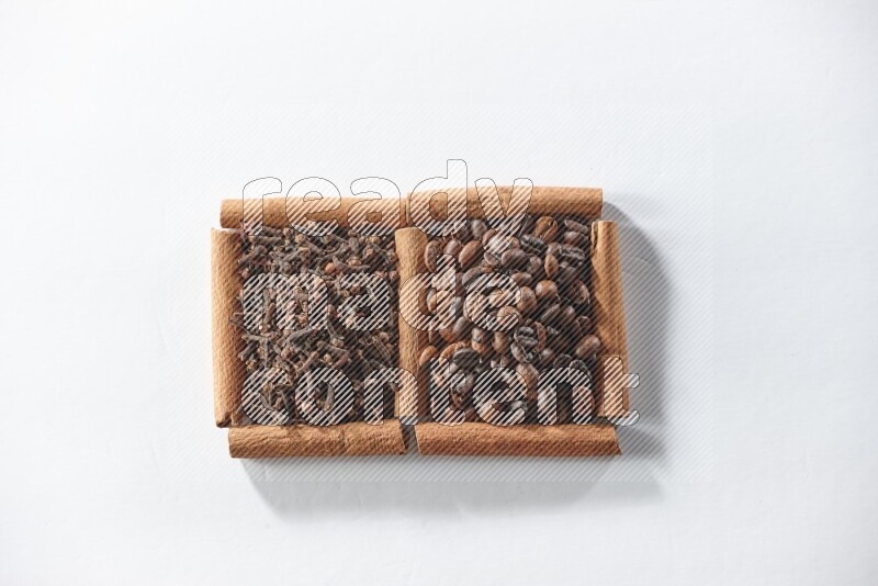 2 squares of cinnamon sticks full of coffee beans and cloves on white flooring