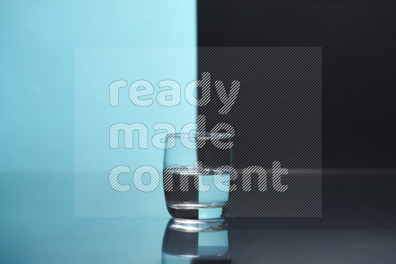 The image features a clear glassware filled with water, set against light blue and black background