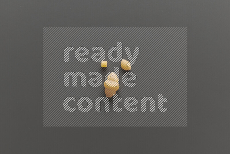 Different pasta types on grey background