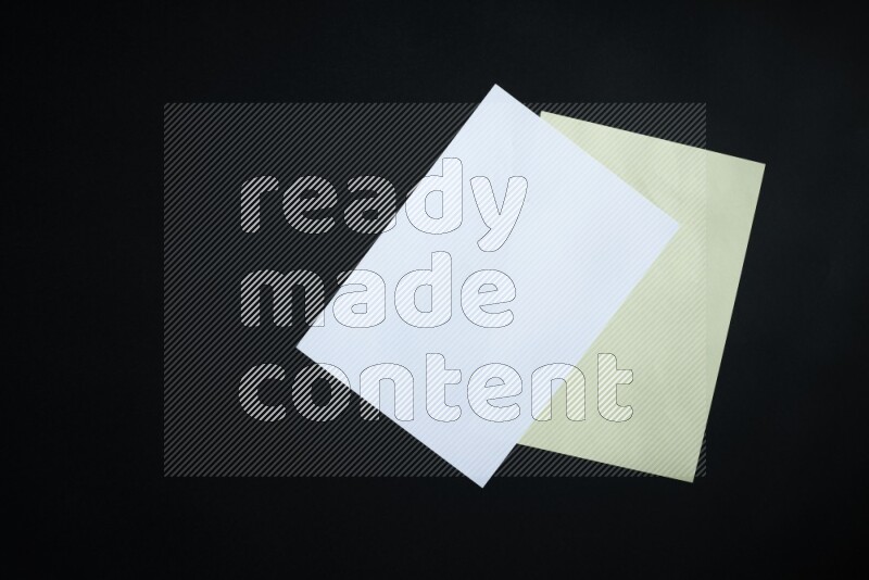 Multicolored paper sheet on black background