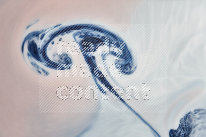 A close-up of abstract swirling patterns in blue, red and white