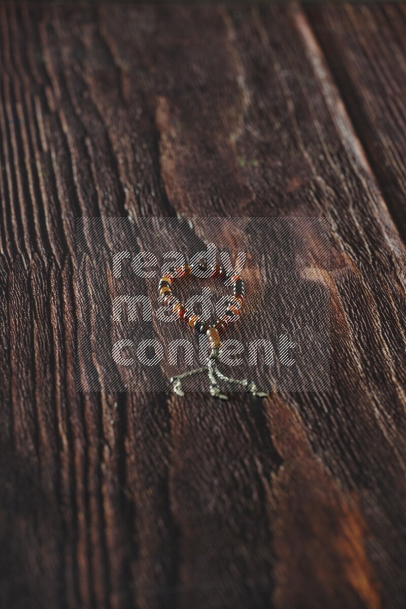 A prayer beads placed on wooden background