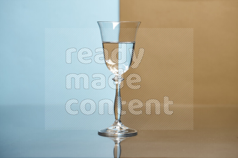 The image features a clear glassware filled with water, set against light blue and beige background