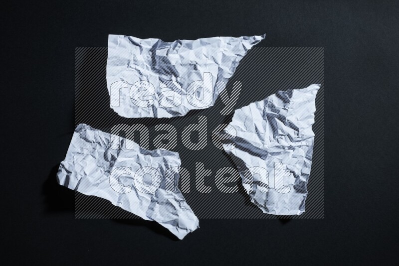 White paper sheet on black background