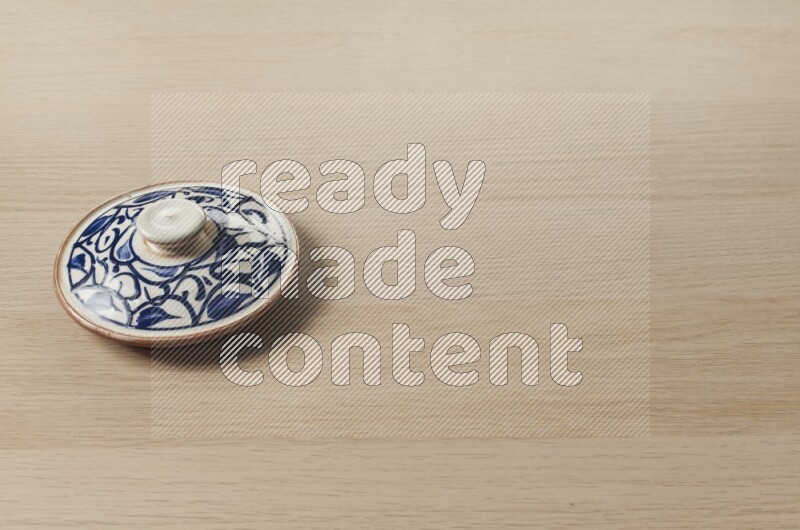 Multicolored Pottery Pot on Oak Wooden Flooring, 45 degrees