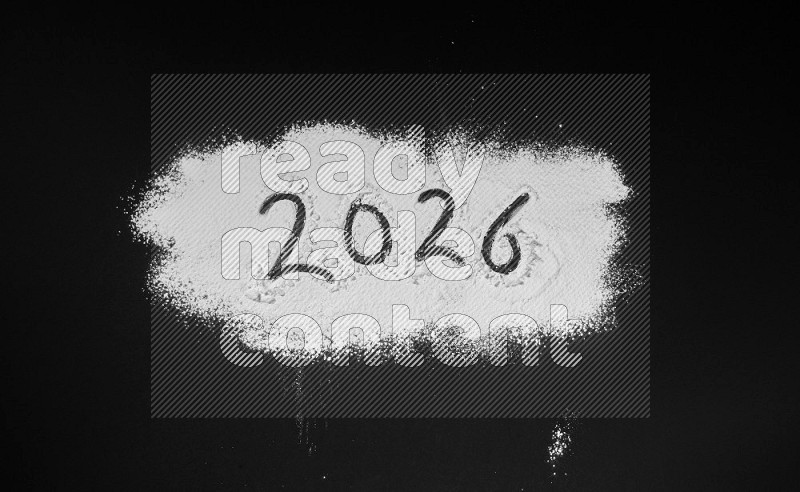 Numbers written with powder on black background