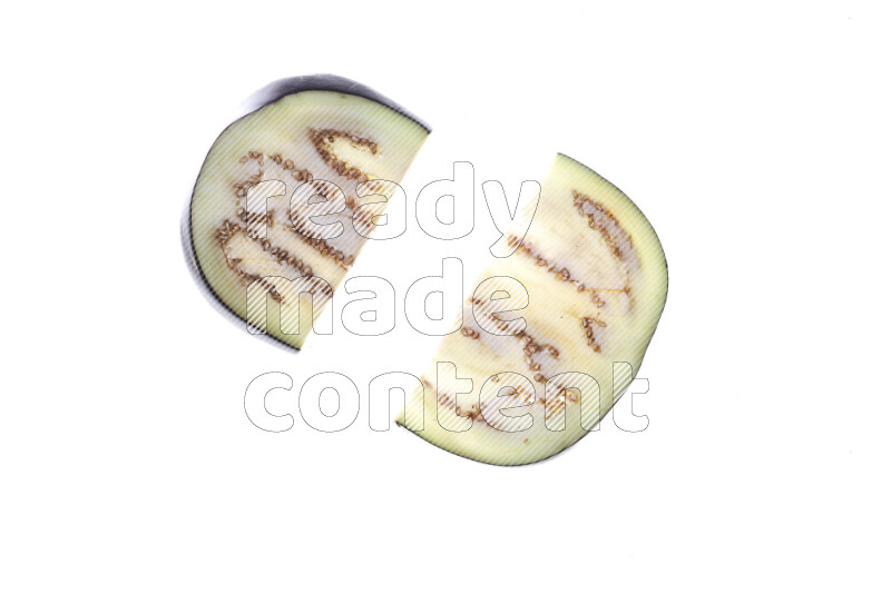 Eggplant slices on illuminated white background