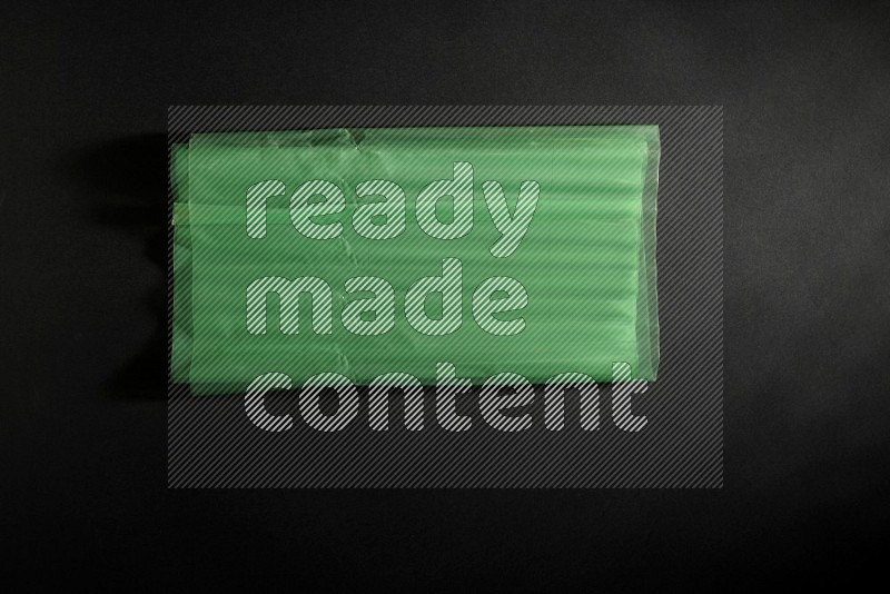 Colored plastic textures on black background