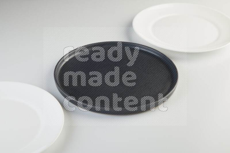 white and black plates on white background