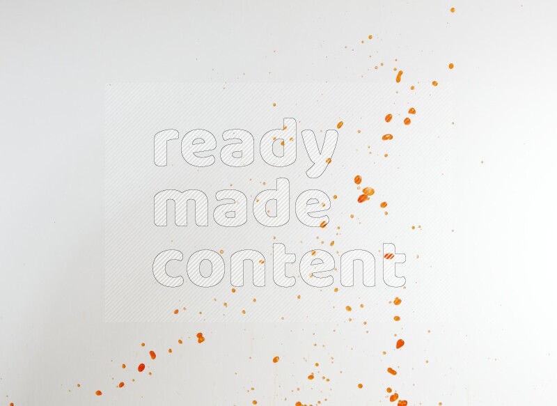 Orange liquid splash and drops on white background