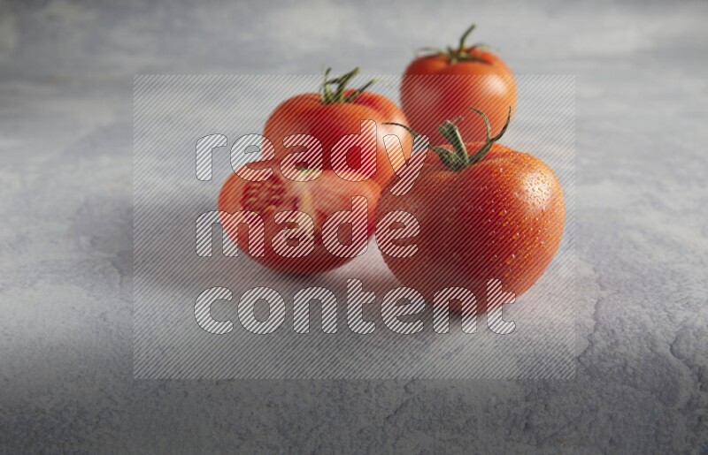 45 degree roma tomato on a textured light blue background