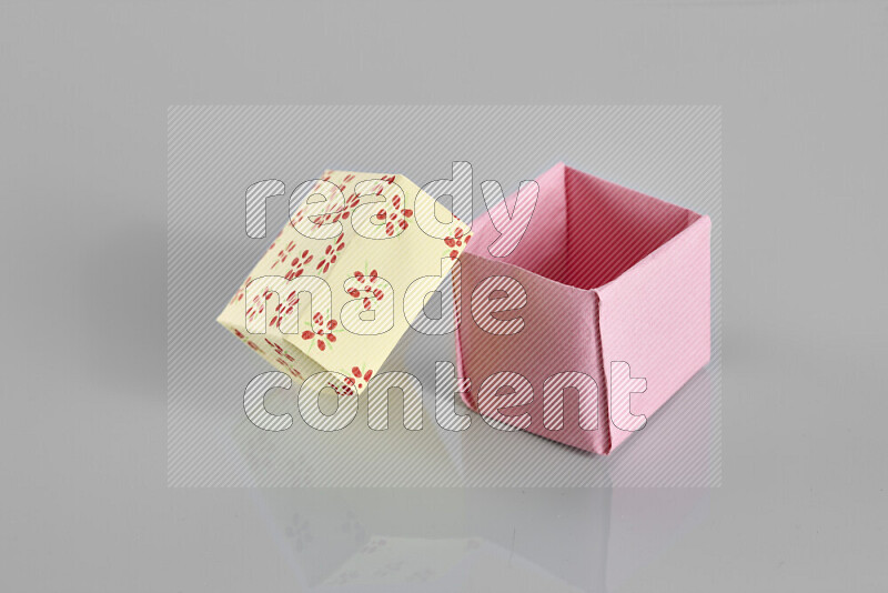 Origami gift box on grey background