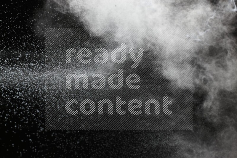 White powder explosion on black background