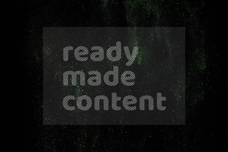 Green glitter powder isolated on black background
