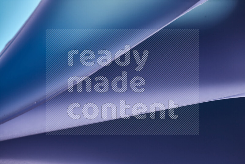 An abstract art piece displaying smooth curves in cold gradients created by colored light