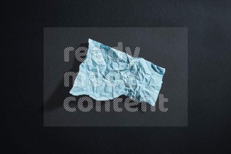 Blue paper sheet on black background