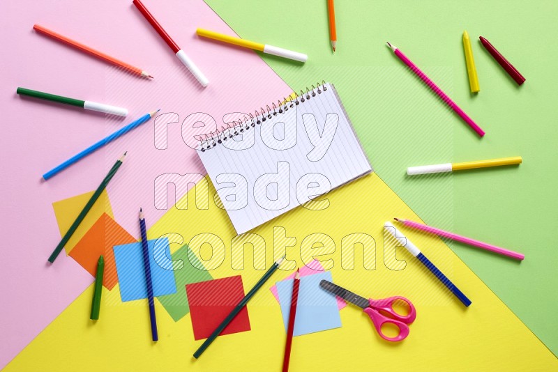 Different school supplies on multicolored backgrounds (back to school)