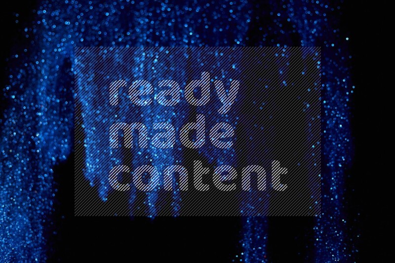 Blue glitter powder isolated on black background