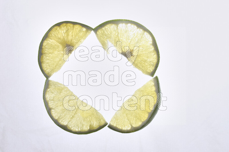 Orange slices on illuminated white background