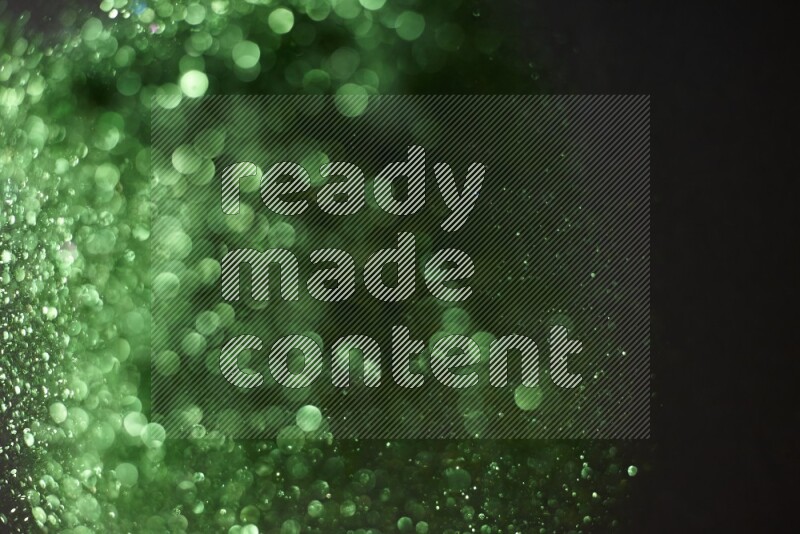 Green glitter powder isolated on black background