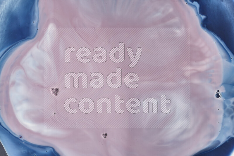 A close-up of abstract swirling patterns in blue, red and white