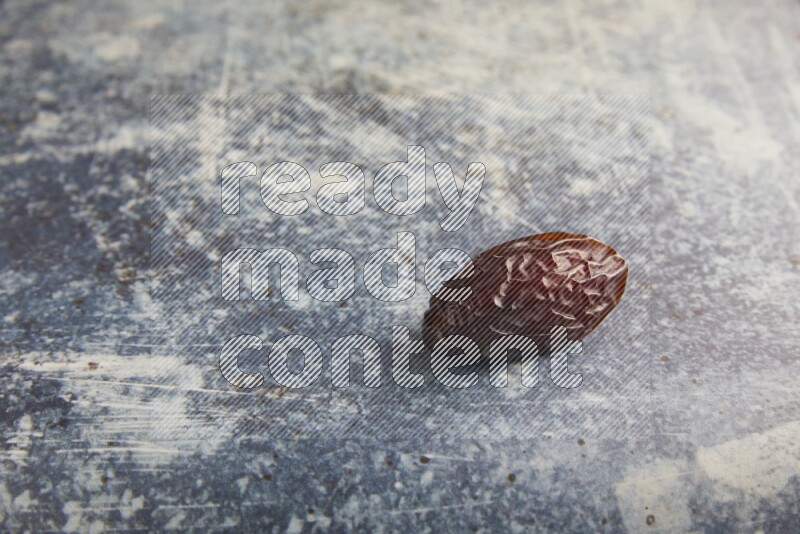 one madjoul date on a rustic blue backround