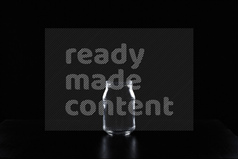 Glassware with rim light against black background