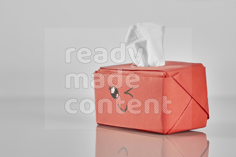 Origami tissue box on grey background