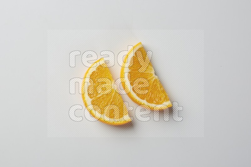 Two halves of an orange slices on white background