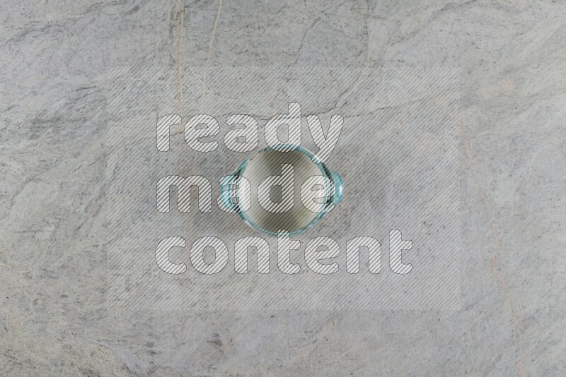 A multicolored pottery Bowl on grey marble background
