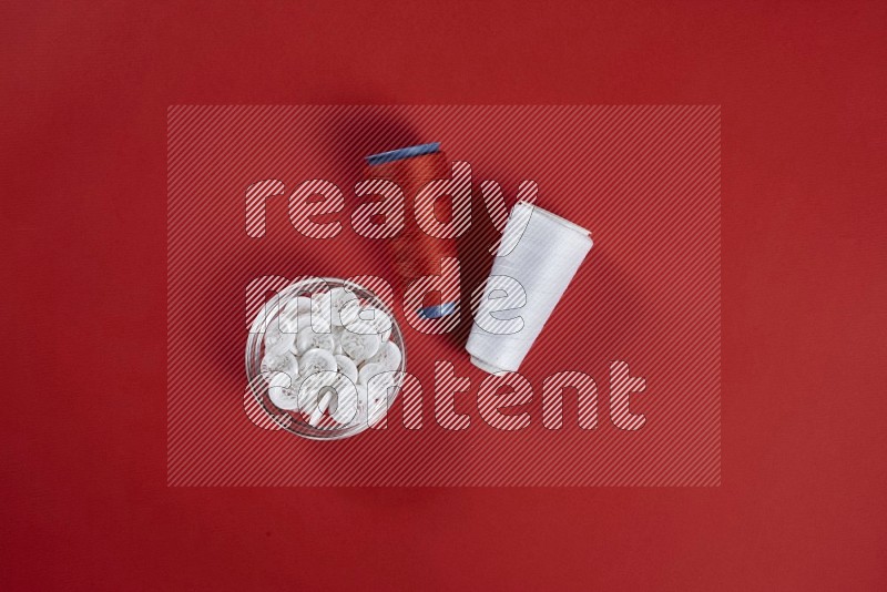 White sewing supplies on red background