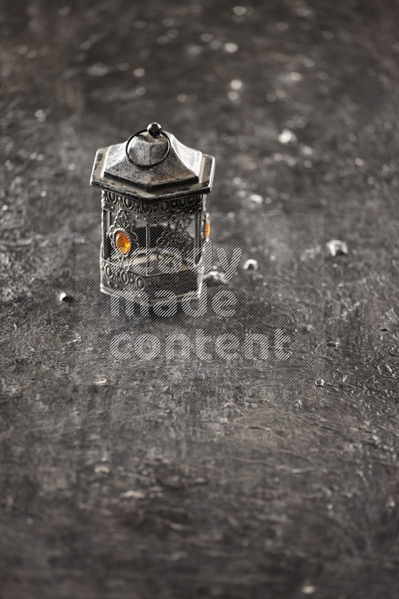 A lantern on textured black background