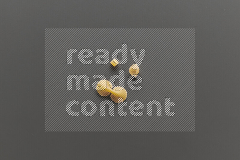 Different pasta types on grey background