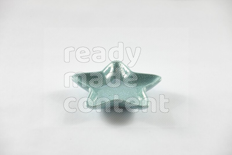 A colored pottery star plate on white background