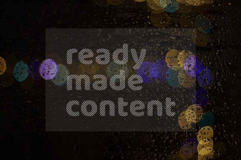 Bokeh light in multicolor with water drops