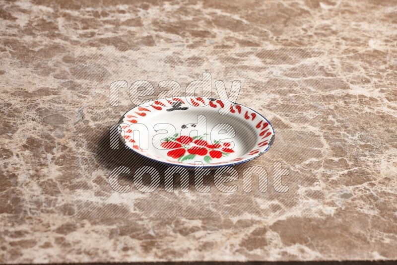 A vintage metal plate on beige marble background