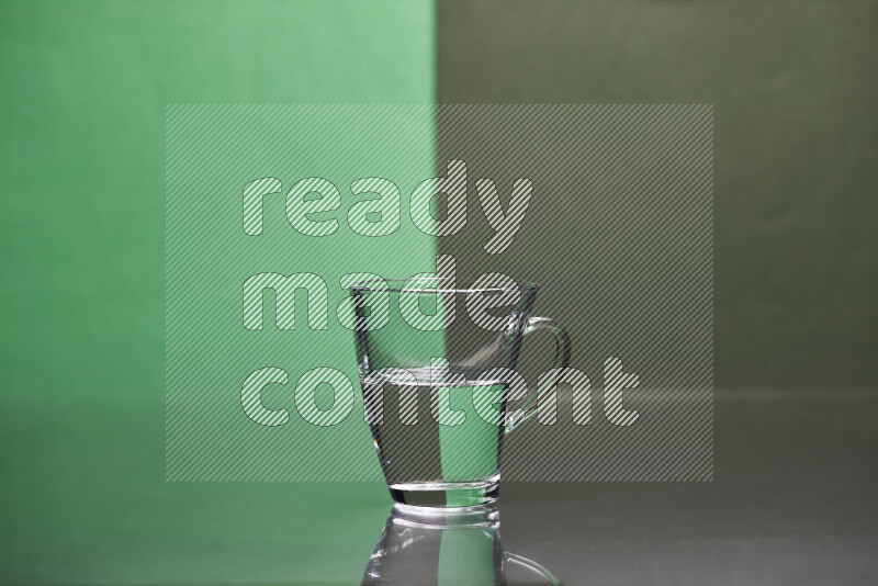 The image features a clear glassware filled with water, set against green and dark green background