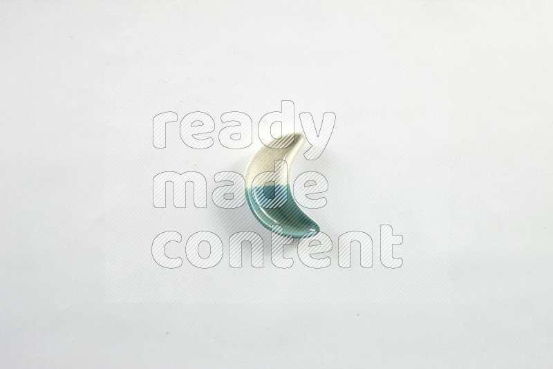 A pottery crescent plate on white background