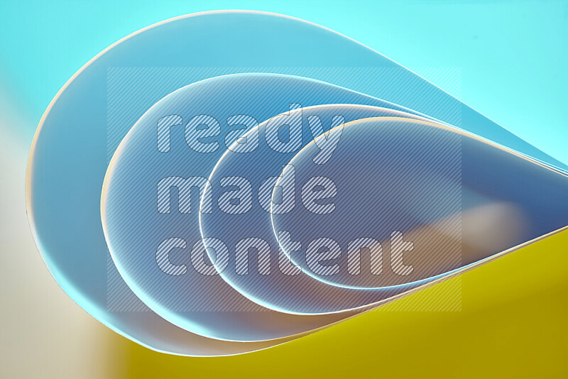 An abstract art of paper folded into smooth curves in blue and yellow gradients