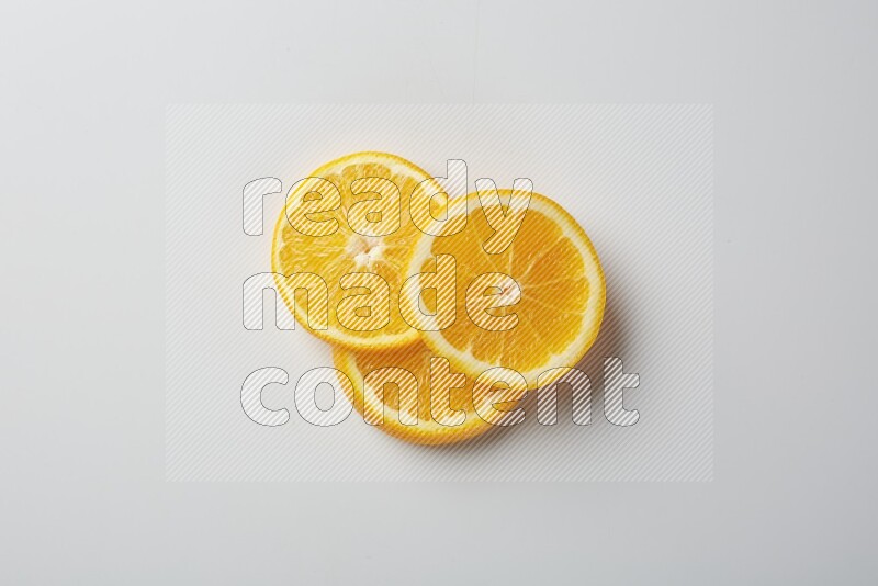 Three orange slices on a white background