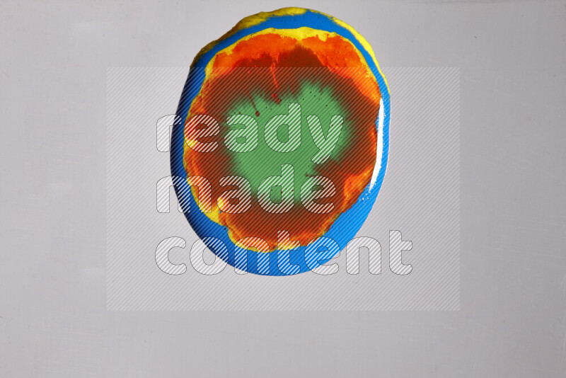 Close-ups of assorted colors blending on a grey background