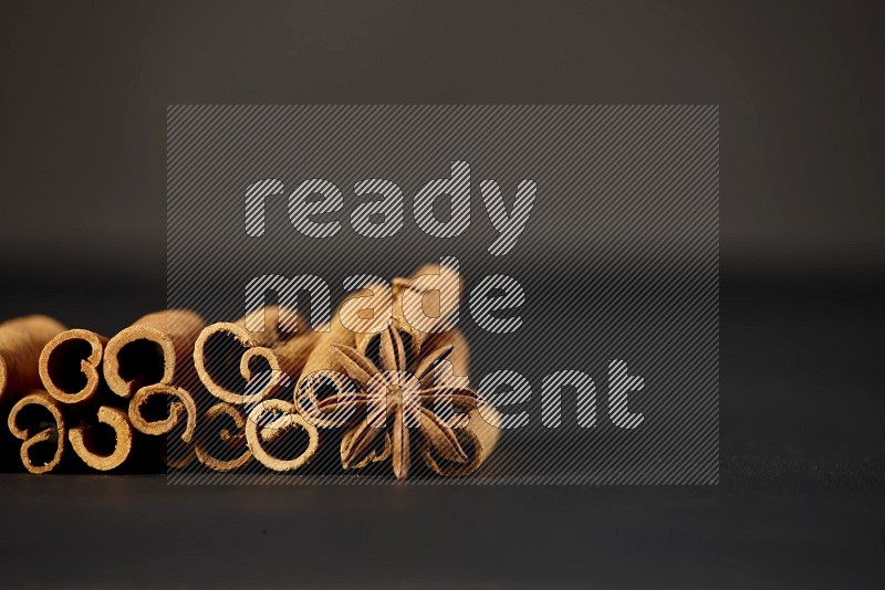Cinnamon sticks and star anise on a black background