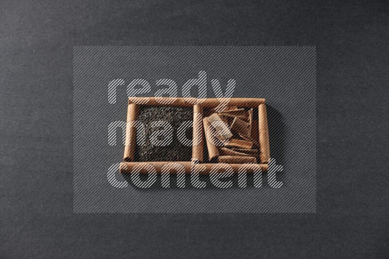 2 squares of cinnamon sticks full of tea and cinnamon on black flooring
