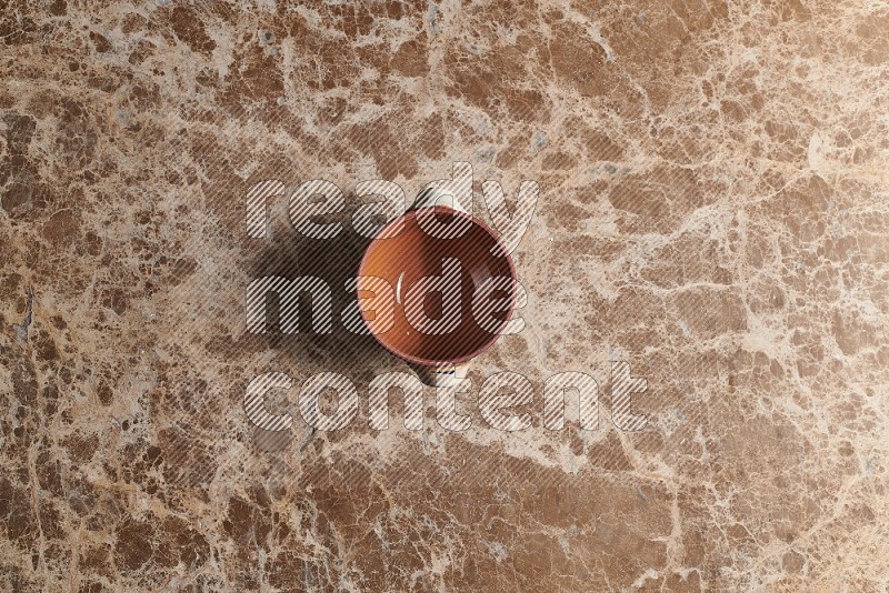 Top View Shot Of A Multicolored Pottery pot On beige Marble Flooring