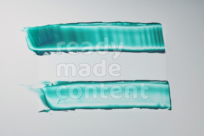 Turquoise painting knife strokes on white background