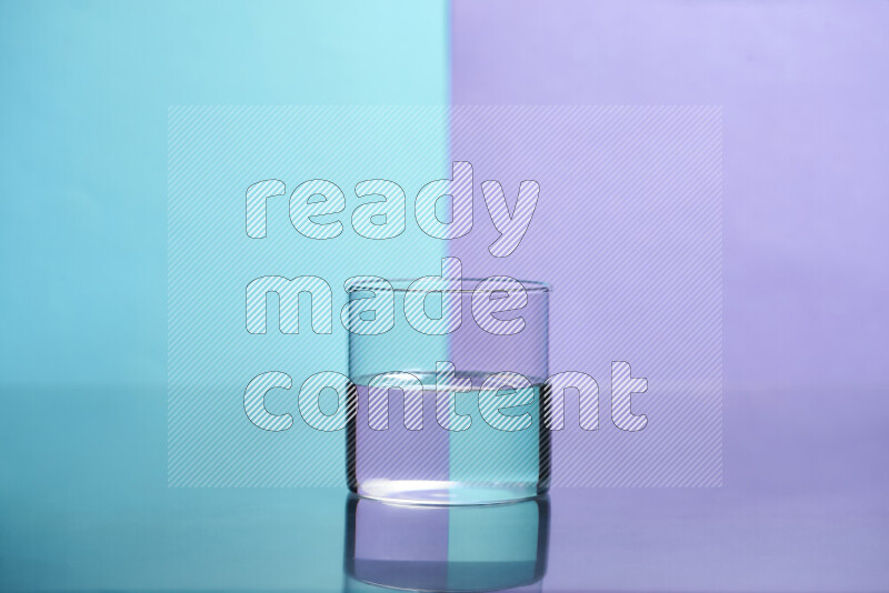 The image features a clear glassware filled with water, set against light blue and light purple background