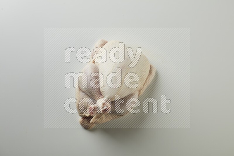 Whole fresh chicken direct on a white background