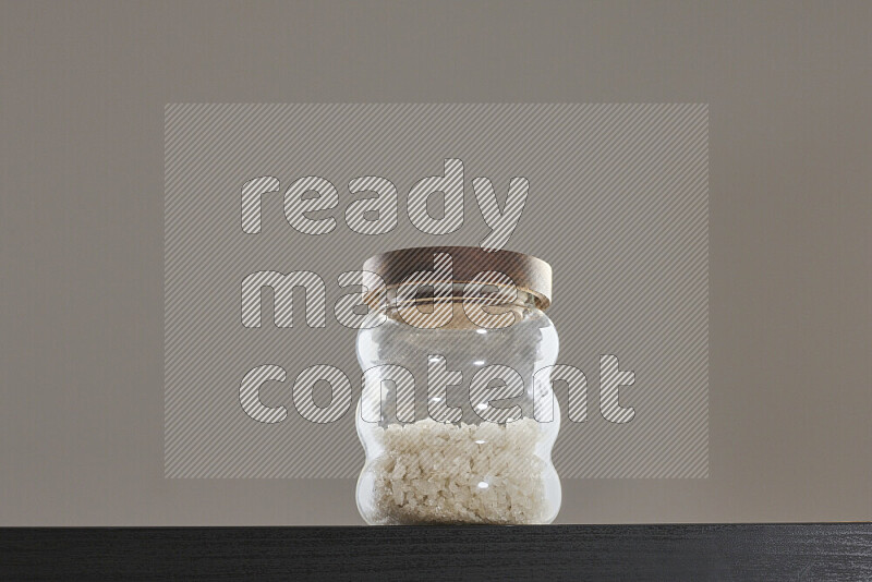 Salt in a glass jar on black background