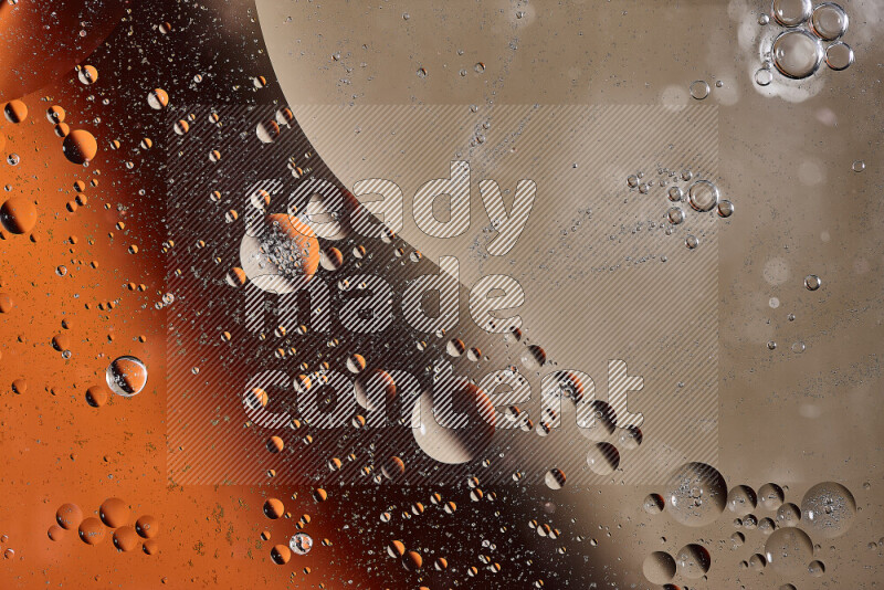 Close-ups of abstract oil bubbles on water surface in shades of orange and brown