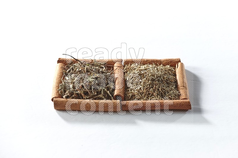 2 squares of cinnamon sticks full of dried basil and cumin on white flooring